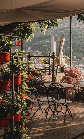 A small shop deck overlooking the ocean and mountains